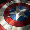 kryptaria: A closeup of Captain America's shield, with paint damage from bullets (cap, shield)