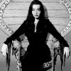 yarnofariadne: morticia addams from the sitcom sitting in a chair (misc: love for the wrote and the writ)