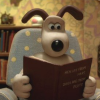 cathyw: Gromit in a blue chair reading "Men are from Mars, Dogs are from Pluto" (reading)