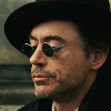 xenacryst: Sherlock Holmes looking over his dark glasses (Holmes: hat and glasses)