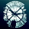 dchan: Two figures silhouetted against a large clock face (time time time...)